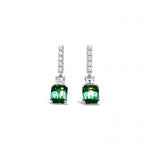 18ct white gold drop earrings featuring emerald-cut green tourmalines with diamond-set bar tops, carré cut accents, and articulated four-claw drops.