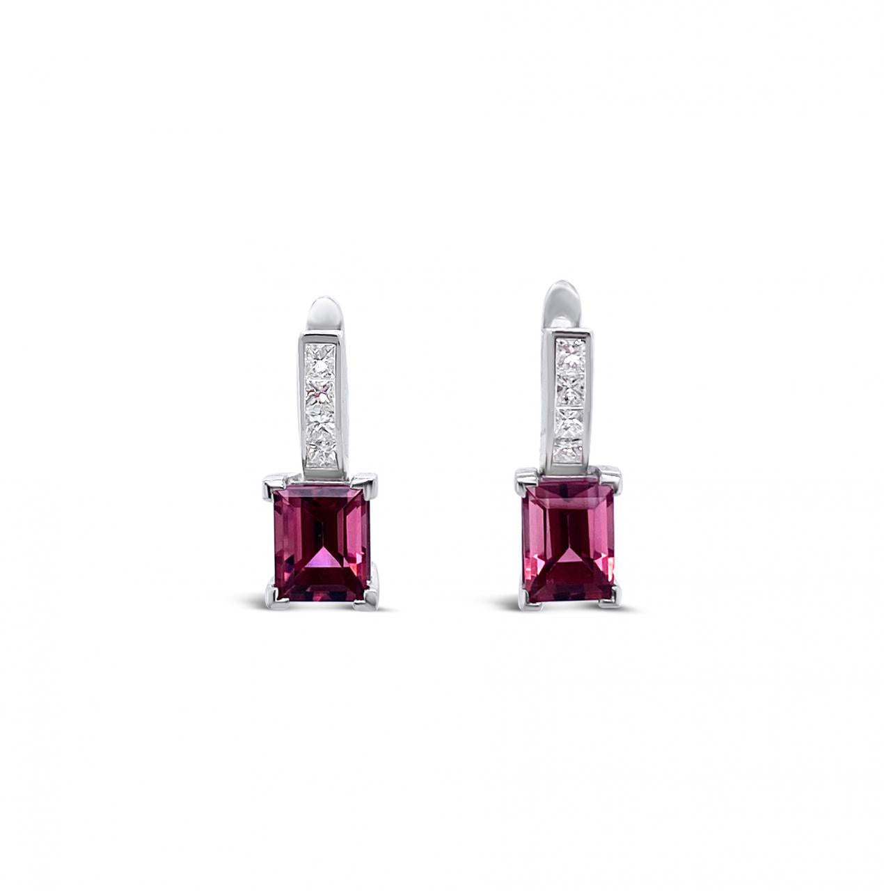 18ct white gold stud earrings featuring round pink tourmalines surrounded by princess cut diamonds, secured with post and butterfly fittings.