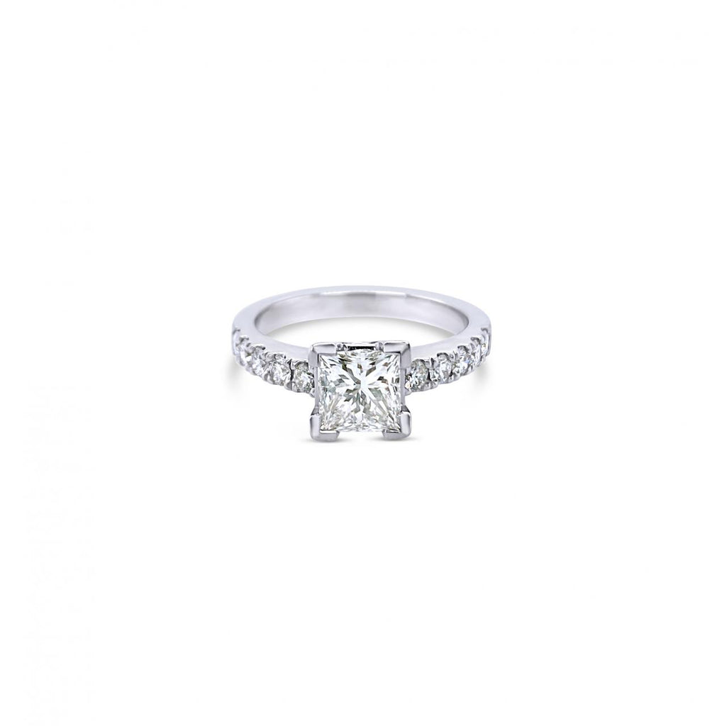 Platinum diamond ring featuring a 1.01ct princess cut centre diamond with corner-claw setting and claw-set diamond shoulders.