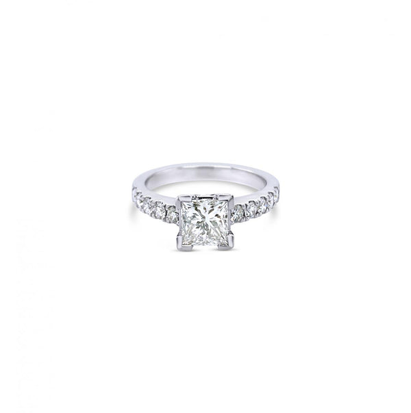 Platinum diamond ring featuring a 1.01ct princess cut centre diamond with corner-claw setting and claw-set diamond shoulders.