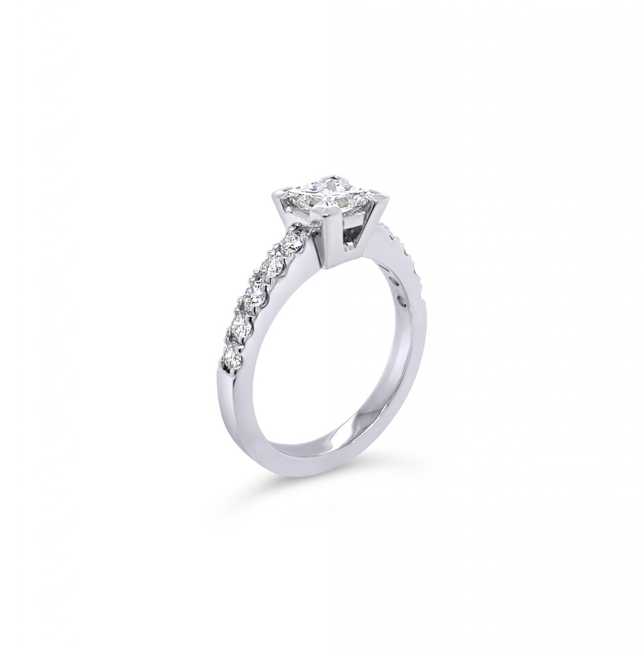 Platinum diamond ring featuring a 1.01ct princess cut centre diamond with corner-claw setting and claw-set diamond shoulders.