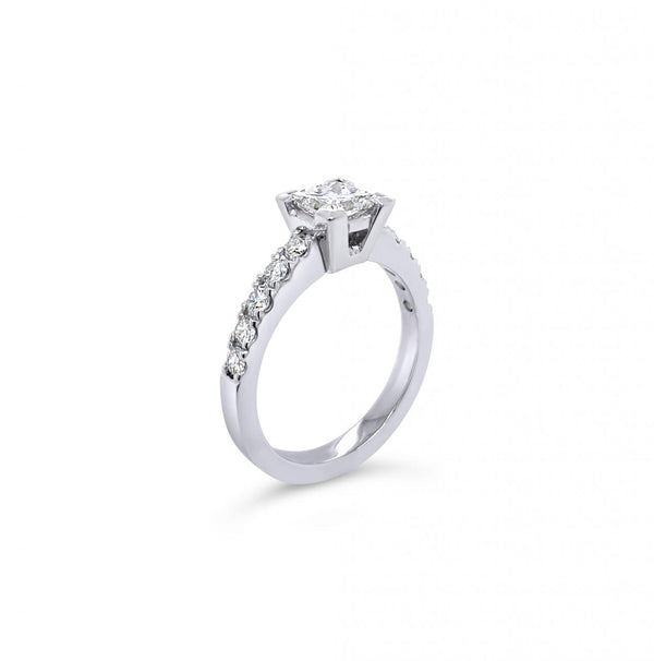 Platinum diamond ring featuring a 1.01ct princess cut centre diamond with corner-claw setting and claw-set diamond shoulders.