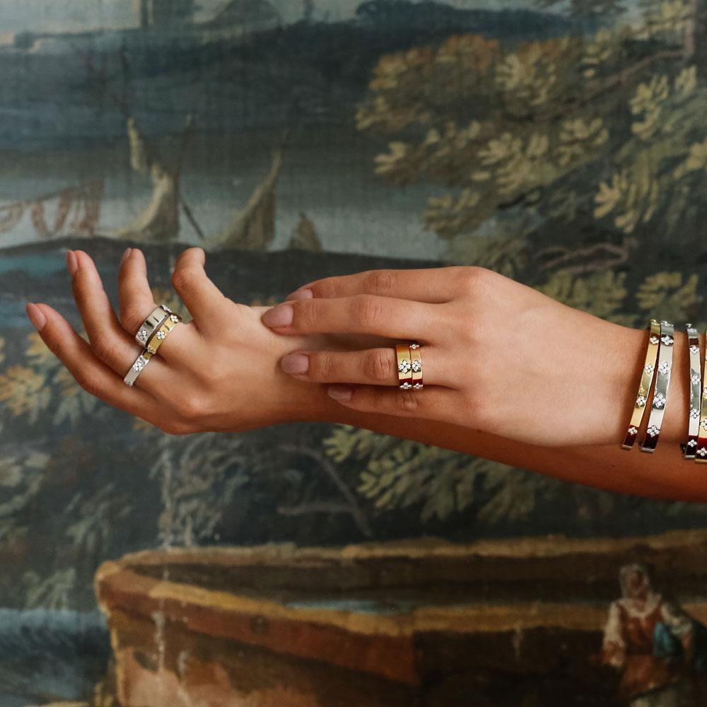 Roberto Coin Love in Verona ring in 18ct rose gold featuring 20 round brilliant cut diamonds and a signature hidden ruby inside the polished 6mm band.