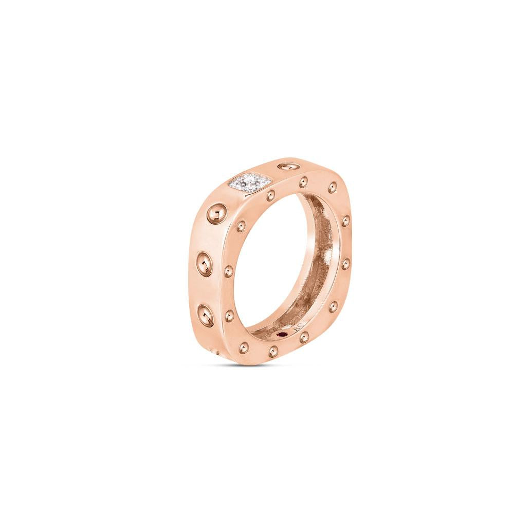 Roberto Coin Pois Moi ring in 18ct rose and white gold featuring concave detailing with diamond bead-set squares and a signature hidden ruby inside the band.