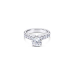 Platinum diamond ring featuring a 1.01ct round brilliant cut centre diamond with sixteen round brilliant cut diamond accents.