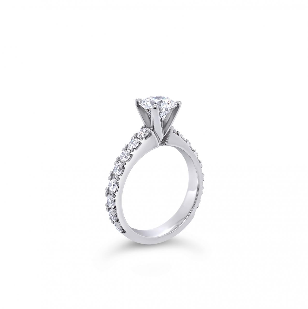 Platinum diamond ring featuring a 1.01ct round brilliant cut centre diamond with sixteen round brilliant cut diamond accents.