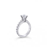 Platinum diamond ring featuring a 1.01ct round brilliant cut centre diamond with sixteen round brilliant cut diamond accents.