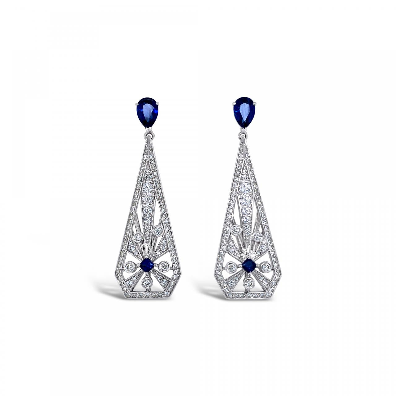 18ct white gold drop earrings with sunray-style sapphire and diamond clusters, tapered cut-out drops, and post and butterfly fittings.