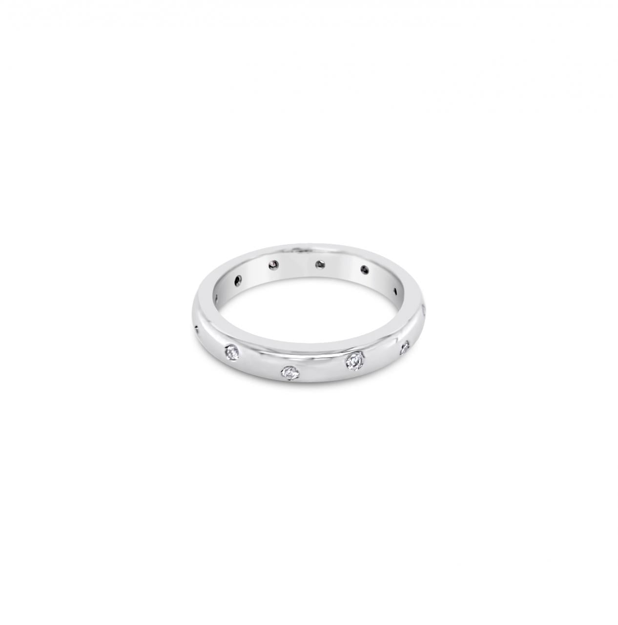 18ct white gold wedding ring featuring twelve round brilliant cut diamonds totalling 0.12ct, scatter-set in a high half-round band.
