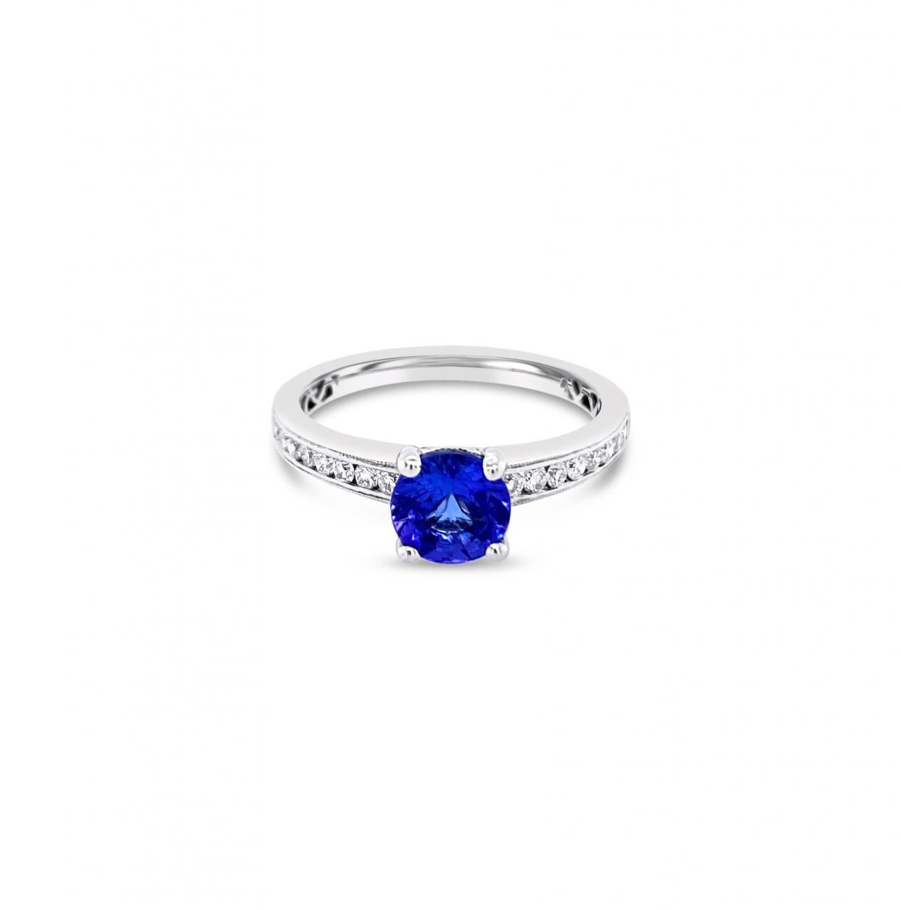 18ct white gold ring with round tanzanite and channel-set diamond shoulders.