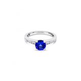 18ct white gold ring with round tanzanite and channel-set diamond shoulders.